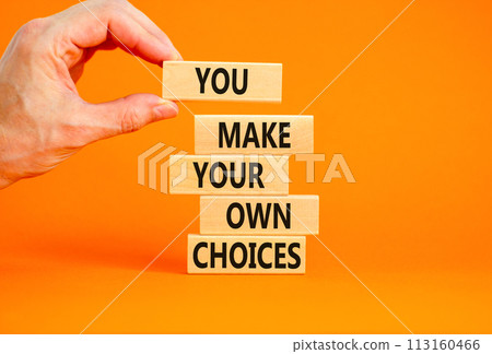 You make your own choice symbol. Concept words You make your own choice on wooden blocks. Beautiful orange background. Businessman hand. Business you make your own choice concept. Copy space. You make your own choice symbol. Concept words You make your own choice on wooden blocks. Beautiful orange background. Businessman hand. Business you make your own choice concept. Copy space. 113160466