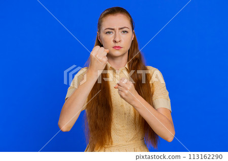 Aggressive angry adult woman trying to fight at camera, shaking fist, boxing, punishment, quarrel 113162290
