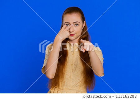 Woman pointing at her eyes and camera show I am watching you gesture spying watching on someone Woman pointing at her eyes and camera show I am watching you gesture spying watching on someone 113162298