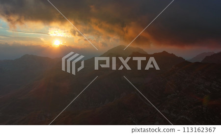 Sunset mountains and dramatic clouds Sunset mountains and dramatic clouds 113162367