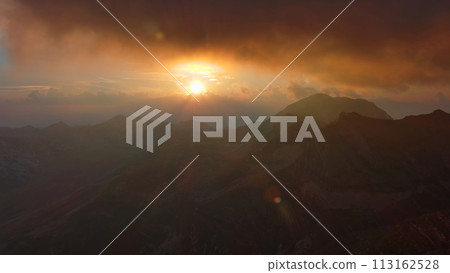 Sunset mountains and dramatic clouds Sunset mountains and dramatic clouds 113162528