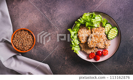 Homemade buckwheat pancakes with fresh vegetables and herbs on a plate top view web banner Homemade buckwheat pancakes with fresh vegetables and herbs on a plate top view web banner 113162876