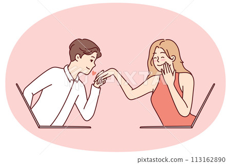 Determined guy kisses hand of embarrassed girl looking out of laptop screen 113162890