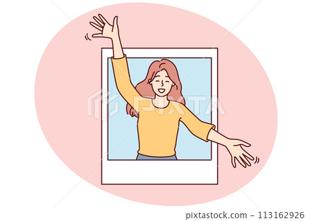 Delighted woman peeks out of photo with arms apart to hug you and give you good mood 113162926