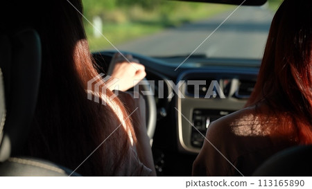 dancing girls driving car. travel machine. vacation sunset, holidays, holidays vacation., sitting front seat, women sitting front seat, girls playing car, two happy girlfriends working as team, young dancing girls driving car. travel machine. vacation sunset, holidays, holidays vacation., sitting front seat, women sitting front seat, girls playing car, two happy girlfriends working as team, young 113165890