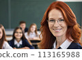 portrait female teacher, smile face, red hair, schoolchildren lesson, children class teacher, background group children, teamwork, group child smile, teacher with glasses, happy eyes school teacher, 113165988