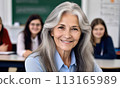 portrait female teacher, smile her face, gray hair, schoolchildren lesson, elderly teacher children class, background group children, teamwork, group child smile, teacher glasses, happy eyes school 113165989