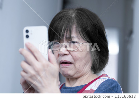 Senior women struggle with how to use their smartphones, and are at risk of being scammed Senior women struggle with how to use their smartphones, and are at risk of being scammed 113166638