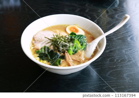 Miso ramen with large slices of pork and various toppings Miso ramen with large slices of pork and various toppings 113167394