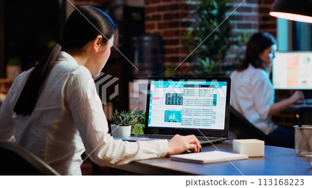 Worker looks over statistical data financial graphs on laptop screen, researching key data for company project. Businesswoman analyzing stock market figures and charts on electronic device, camera B Worker looks over statistical data financial graphs on laptop screen, researching key data for company project. Businesswoman analyzing stock market figures and charts on electronic device, camera B 113168223