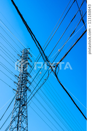 High-voltage power transmission towers, intersecting power lines in the city, and clear skies b-2 High chroma contrast 113168643