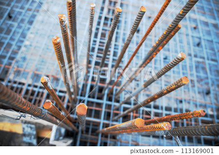 Frame made of steel reinforcement at a construction site ready to be poured with concrete. Frame made of steel reinforcement at a construction site ready to be poured with concrete. 113169001