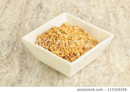 Crunched roasted peanut in the bowl 113169266