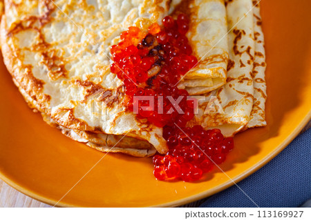 Russian pancakes with red caviar 113169927