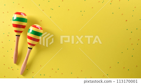 Cinco de Mayo holiday background made from maracas stars on yellow background. Cinco de Mayo holiday background made from maracas stars on yellow background. 113170001