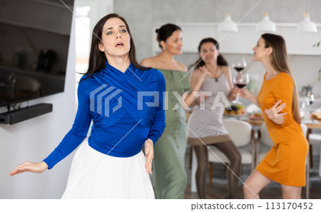 Smiling women dancing at a bachelorette party - girlfriends home party 113170452