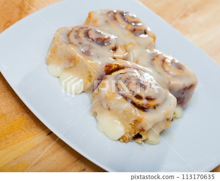 Cinnamon rolls on white plate 113170635