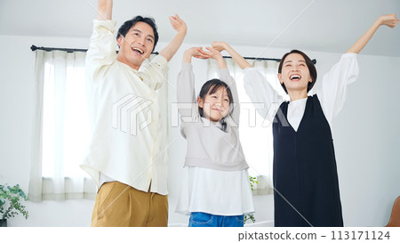 family relaxing indoors 113171124