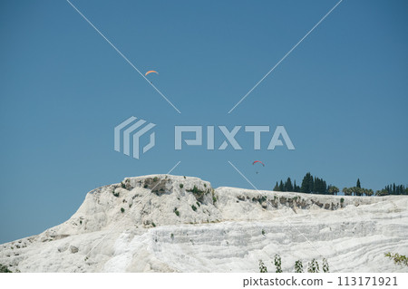 paragliding over the travertines in Pamukkale paragliding over the travertines in Pamukkale 113171921