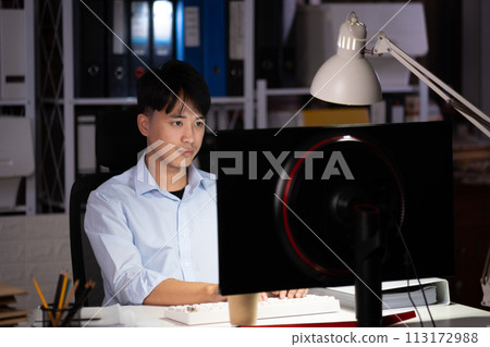 Businessman working overtime at his office He felt tired. 113172988