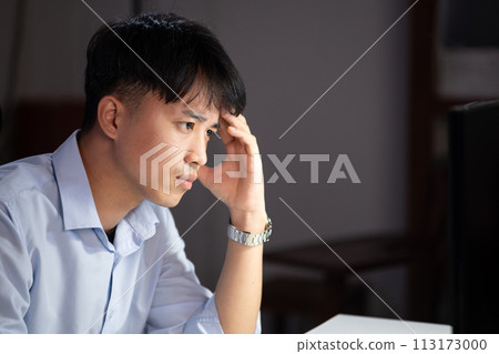 Businessman working overtime at his office He felt tired. 113173000