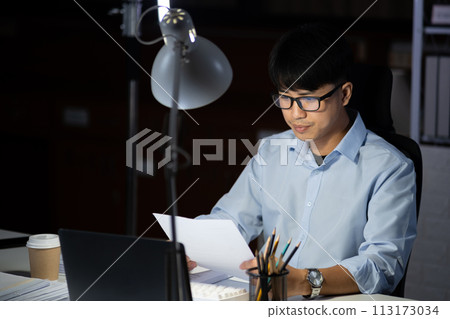 Businessman working overtime at his office He felt tired. Businessman working overtime at his office He felt tired. 113173034