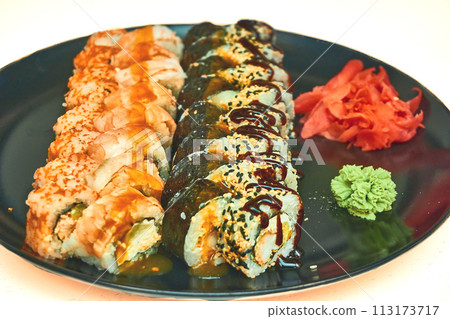 Fresh delicious sushi set with red fish delivered to home, office Fresh delicious sushi set with red fish delivered to home, office 113173717