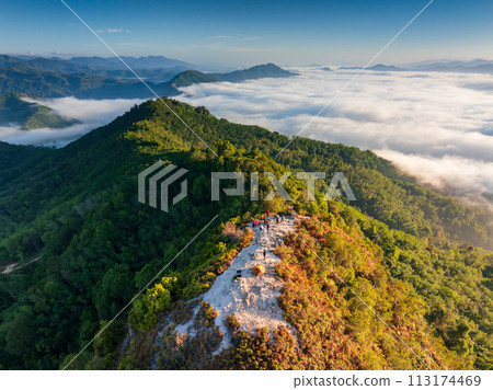 Aerial drone view beautiful morning Sunrise and Fog flow over mountain in Ai yerweng, Yala, Thailand Aerial drone view beautiful morning Sunrise and Fog flow over mountain in Ai yerweng, Yala, Thailand 113174469