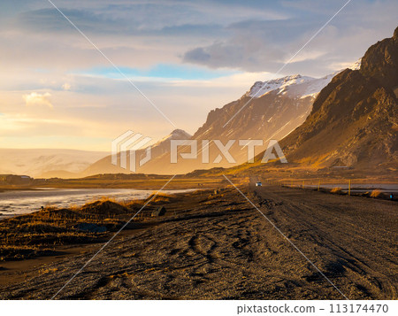 Vestrahorn mountain with black volcanic lava sand dunes at sunset, Stokksnes, Iceland 113174470