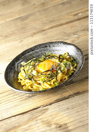 Abura soba topped with egg yolk, shredded seaweed, and green onions Abura soba topped with egg yolk, shredded seaweed, and green onions 113174659