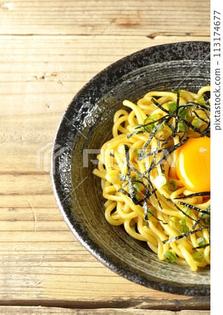 Abura soba topped with egg yolk, shredded seaweed, and green onions 113174677