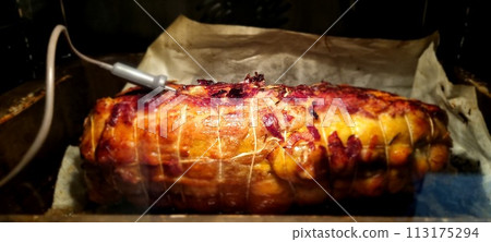 Succulent roasted pork loin on baking tray 113175294