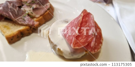 Gourmet italian bruschetta with cured meat Gourmet italian bruschetta with cured meat 113175305