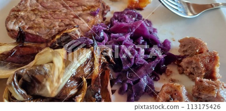 Savory grilled steak with roasted vegetables close-up 113175426