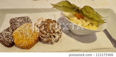 Assorted mini pastries with whipped cream Assorted mini pastries with whipped cream 113175466