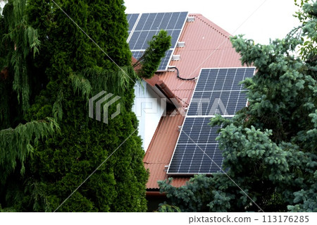 Installing a Solar Cell on a Roof. 113176285