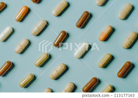 Various pills on a beige background. 113177163