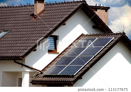 Installing a Solar Cell on a Roof. 113177675