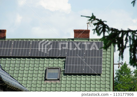Installing a Solar Cell on a Roof. 113177906
