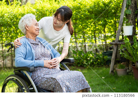 caregiver help and care Asian senior woman patient sitting on wheelchair at nursing hospital ward, healthy strong medical concept. 113180566