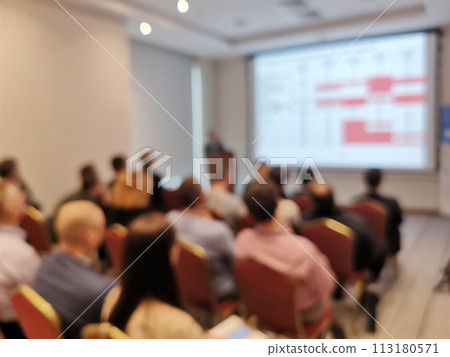 Blurred background image of audience in a business conference or seminar. Blurred background image of audience in a business conference or seminar. 113180571