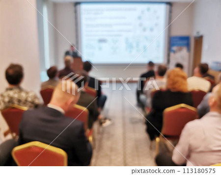 Blurred background image of audience in a business conference or seminar. Blurred background image of audience in a business conference or seminar. 113180575