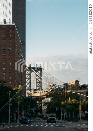Manhattan Bridge Framed by New York Buildings under Clear Skies Manhattan Bridge Framed by New York Buildings under Clear Skies 113182010