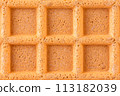 Macro view of spelt waffle with a grid pattern 113182039