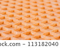 Spelt waffle with a grid pattern, macro closeup perspective view 113182040