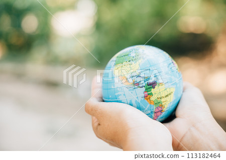 Embrace the globe and a green leaf on World Earth Day to convey the concepts of Green Energy, ESG, and Environmental Care. Signify responsibility and global support for our environment. 113182464