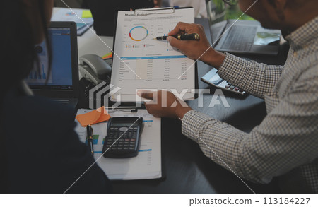 Business team meeting working with new startup project, discussion and analysis data the charts and graphs. Digital tablet, calculator, laptop computer using, Business finance and accounting concept. Business team meeting working with new startup project, discussion and analysis data the charts and graphs. Digital tablet, calculator, laptop computer using, Business finance and accounting concept. 113184227