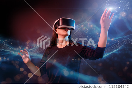 Woman with VR virtual reality goggles 113184342