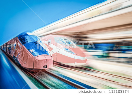 Modern hi-speed passenger train, in movement (motion) on railways station. Modern hi-speed passenger train, in movement (motion) on railways station. 113185574
