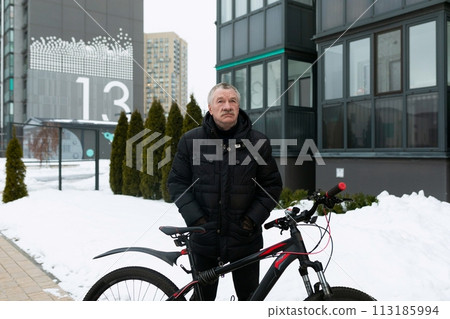 European elderly man riding a bicycle in the city European elderly man riding a bicycle in the city 113185994